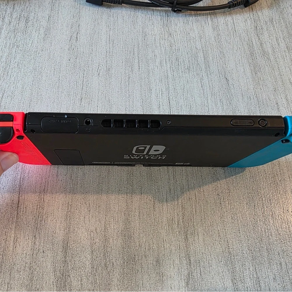 Nintendo Switch with Neon Blue and Neon Red Joy-Con - Handheld Gaming Console - Picture 7 of 9